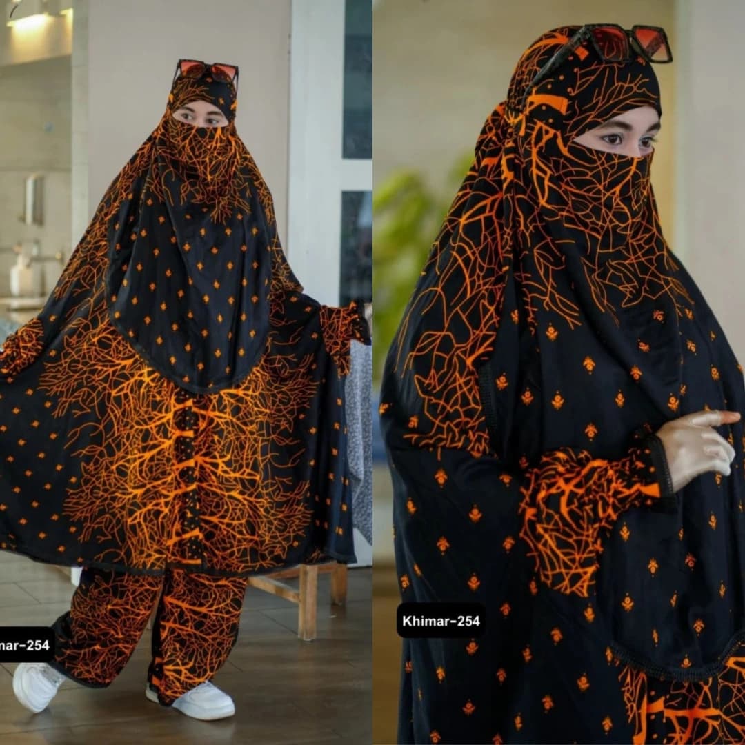 Plazu khimar in black and copper orange abstract print, elegant and comfortable modest wear for women
